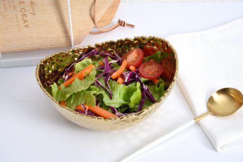 Image by Medium, gold oval bowl