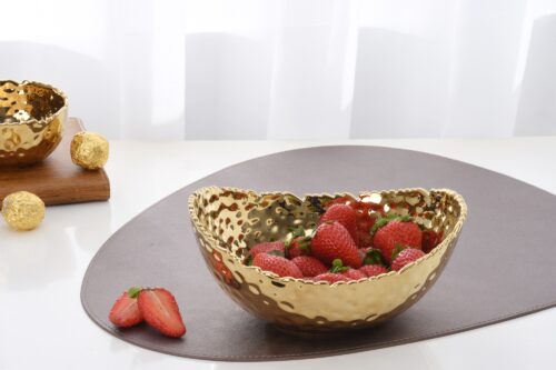 Image by Medium, gold oval bowl