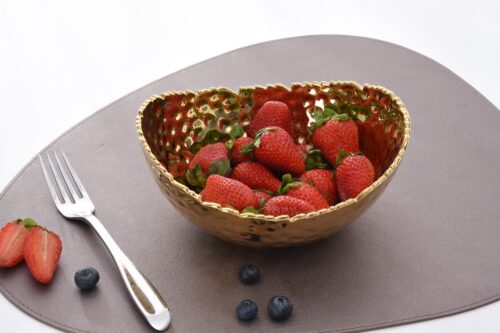 Image by Medium, gold oval bowl