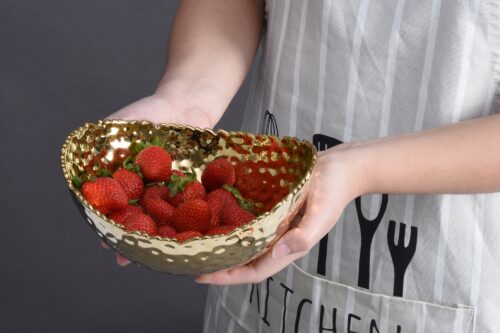 Image by Medium, gold oval bowl