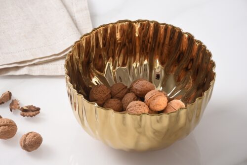 Close-up of the gold-tone porcelain finish.