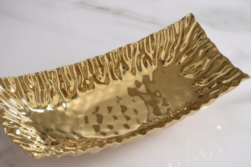 Close-up of the gold-tone porcelain finish.