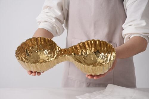 Close-up of the gold-tone porcelain finish.