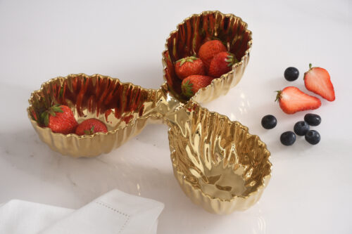 Serving strawberries, showcasing the luxurious gold-tone high-fired porcelain finish.