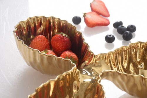 Serving strawberries, showcasing the luxurious gold-tone high-fired porcelain finish.