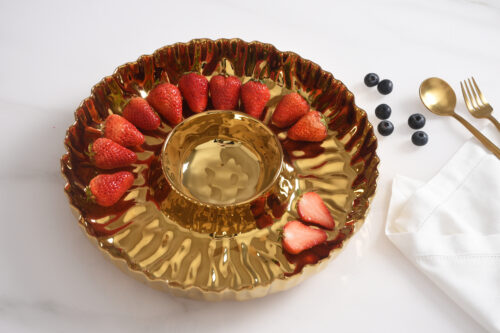 Serving strawberries, showcasing the luxurious gold-tone high-fired porcelain finish.