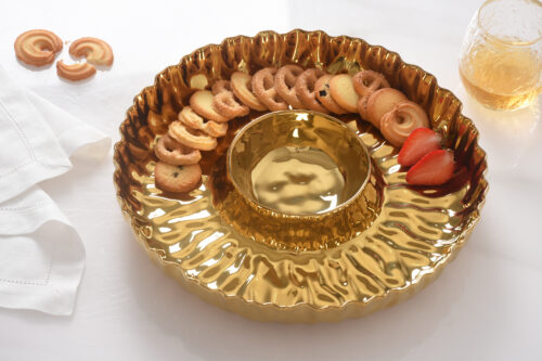 With strawberries, highlighting its gold-tone porcelain finish.